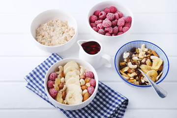 Healthy vegetarian cereal breakfast. Smoothie bowl with berries and nuts.