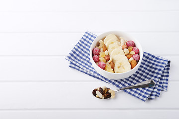 Healthy vegetarian cereal breakfast. Smoothie bowl with berries and nuts.