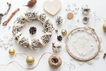 Flat lay top view Christmas photo with an embroidery hoop and cute decoration.