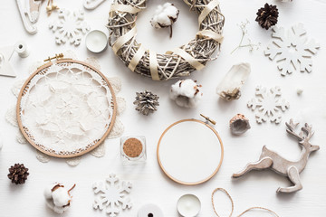 Flat lay top view Christmas photo with an embroidery hoop and cute decoration.