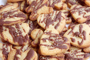 background heart shape butter cookies with chocolate and nuts, texture, pattern
