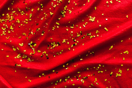 The red background. Glitters. Gold sequins
