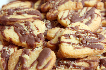 background heart shape butter cookies with chocolate and nuts, texture, pattern
