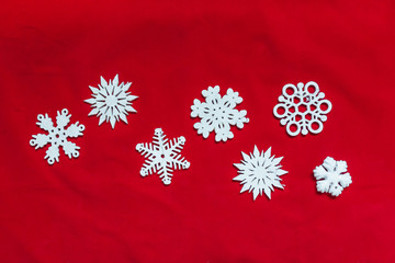 Snowflakes on a red background. Christmas toy drive.