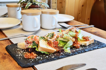  Mexican seafood salad on black slate plate 
