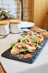  Mexican seafood salad on black slate plate 