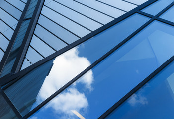 Reflections of sky and clouds in modern building