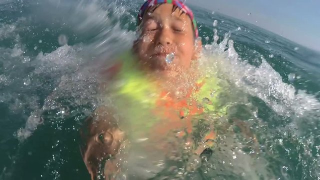 boy on pedal boat pulls off the hill into the sea