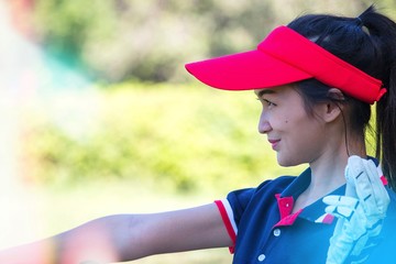 Lady golfer in playing golf