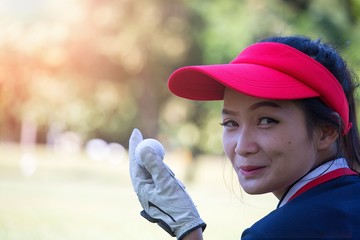 Lady golfer in playing golf