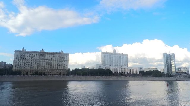 house of government and other buildings on the river bank timelapse