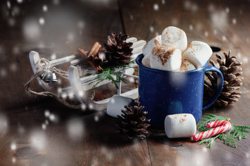 Hot chocolate and marshmallow, Christmas holiday drink, snow effect, selective focus, toned image