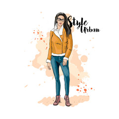 Urban style. Fashionable bow. Clothing for the street. The winter version. Hand drawn sketch. Stylish young woman in cropped sheepskin coat and jeans. Vector illustration.