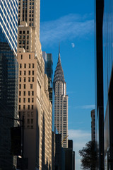 Fototapeta na wymiar Chrysler Building at daylight with moon in winter afternoon