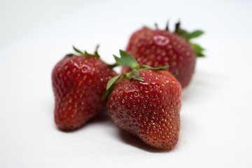 Three Isolated Strawberries