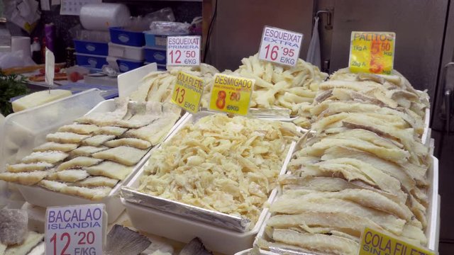 Frozen fish fillets in the market La Boqueria in Barcelona