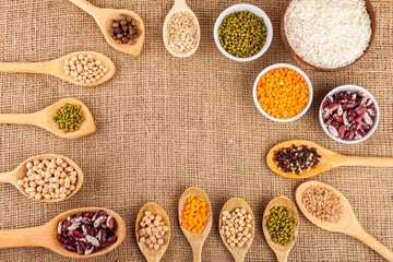 Assorted grain, beans, legumes, peas, lentils in spoons on a