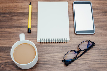 Smartphone,notebook,pen,eyeglasses