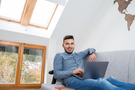 Young man studying at home. Exams preparing concept  