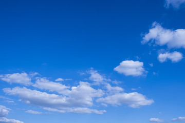 Obraz premium Blue sky background with white clouds.