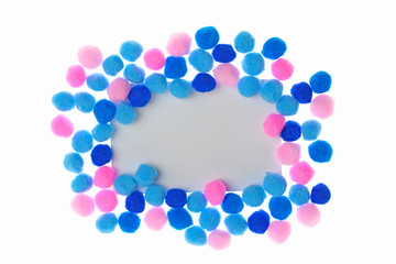 Pompon background. Pompon Mockup.  frame of bright dark blue,  blue and pink little woolen pompoms isolated on white background. Winter Mock up. copy space