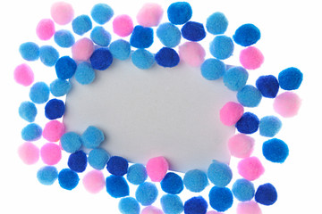 Pompon background. Pompon Mockup. rectangular frame of bright dark blue,  blue and pink little woolen pompoms isolated on white background. Winter Mock up. copy space