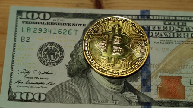 Coin bitcoin and dollars.