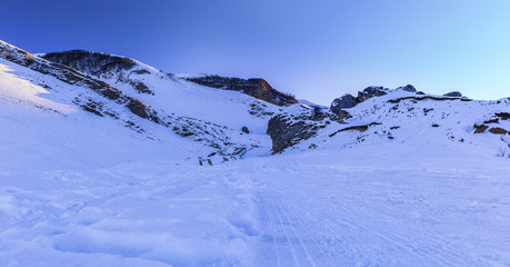Fototapeta na wymiar Snow-covered road in the mountains