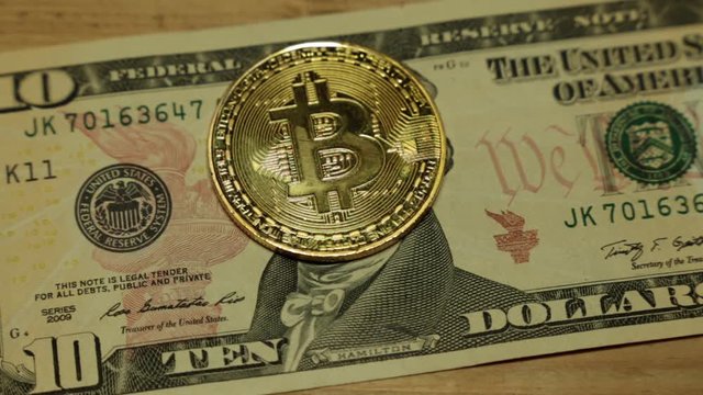 Bitcoins and dollar. US dollar and bitcoin coin.