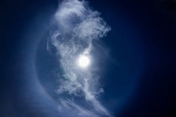 Naklejka na ściany i meble sun halo occurring due to ice crystals in atmosphere