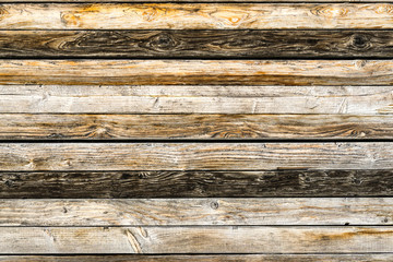 Old natural brown barn wood wall. Wooden textured background pattern.