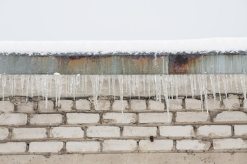 Dangerous icicles on the house roof
