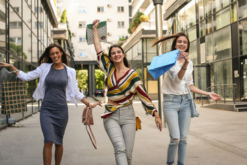 Obraz premium That was good shopping. Satisfied women. On the move.
