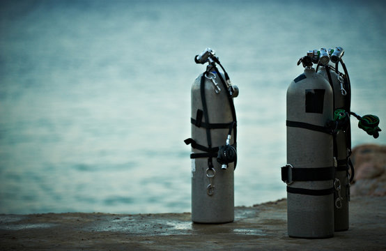 Collection Of Grey Scuba Diving Air Oxygen Tanks.