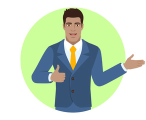Businessman showing thumb up and showing something