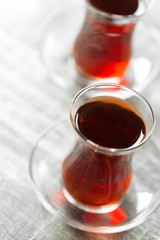 Red tea in turkish glasses on a wooden table