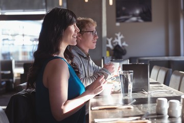 Couple having breakfast in the kitchen