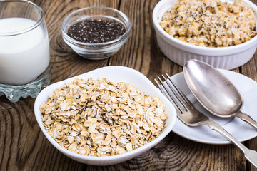 Oat flakes in white bowl for cooking