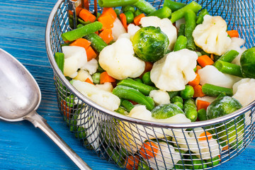 Frozen mixt of vegetables with Brussels and cauliflower, carrots, peas and beans