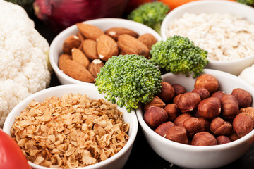 Fresh raw vegetables with nuts and cereals for cooking or eating. Vegetarian food.