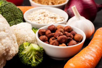 Fresh raw vegetables with nuts and cereals for cooking or eating. Vegetarian food.