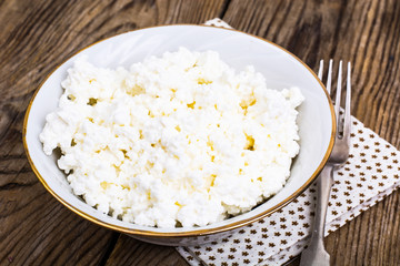 Fresh homemade cottage cheese in white bowl