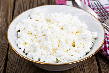 Fresh homemade cottage cheese in white bowl