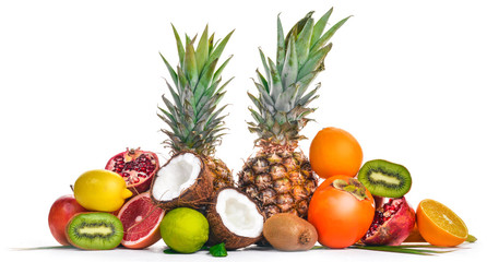 Fresh Tropical Fruits. Pineapple, coconut, kiwi, orange, pomegranate, grapefruit. On a wooden background. Top view. Free space for text.