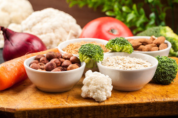 Fresh raw vegetables with nuts and cereals for cooking or eating. Vegetarian food.