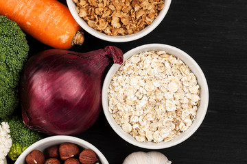 Fresh raw vegetables with nuts and cereals for cooking or eating. Vegetarian food. Top view