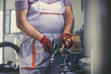 Senior man in workshop. Close up.