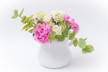 Pink and white bunch of flowers, white vase of little flowers isolated on white background
