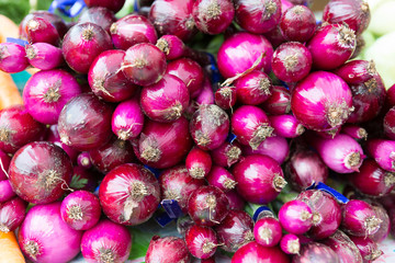 Close up of Purplette onions at the farmers market