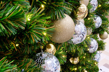 Glitter gold and silver Christmas ball decorated on the tree